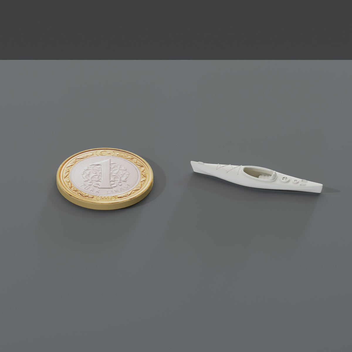 Minyatür Kano No.29 — Sade Oyuncak — ölçekli render: 1 TL madeni paranın yanında XL boy (37 mm)